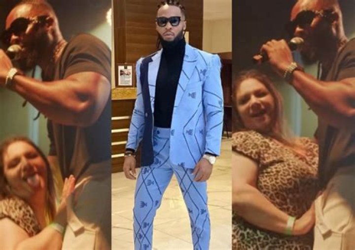 
“E Remain Make She Put Hand Inside Trouser” –Netizen React As Oyibo Fan Caresses Flavour On Stage 